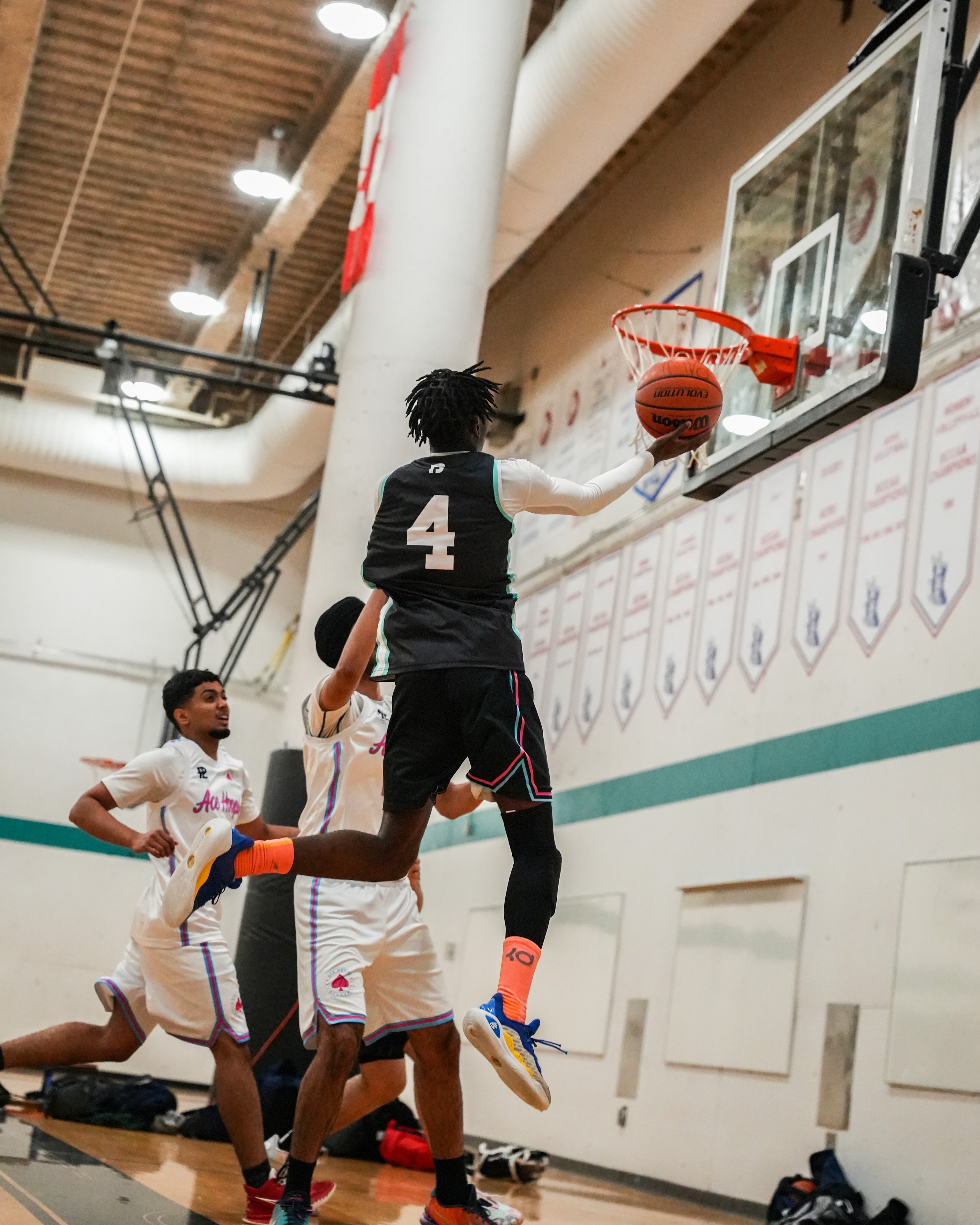 Born2Grind athlete going up for a layup